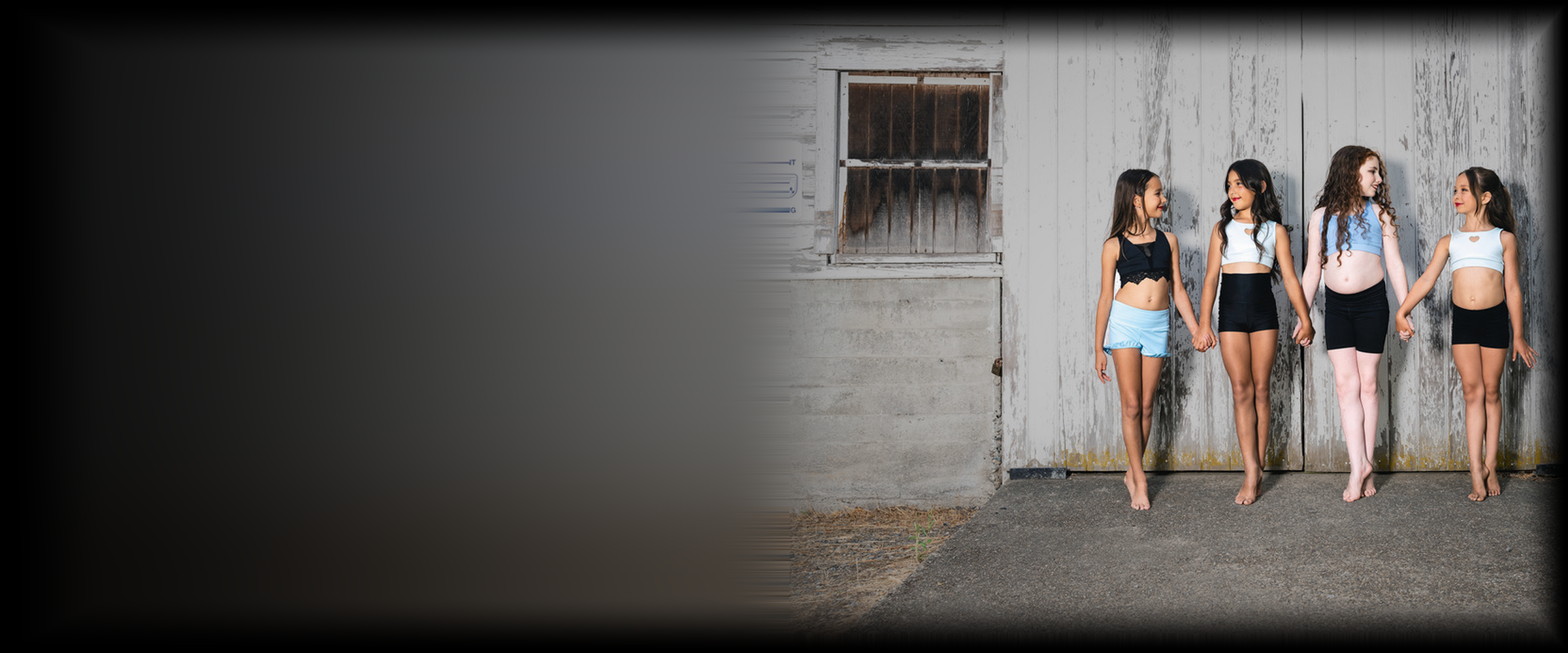 Elite Dance Company Level 1 dancers holding hands at the studio photoshoot